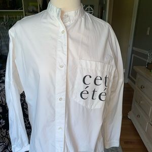 White button down shirt  Has “Cet ete” on pocket